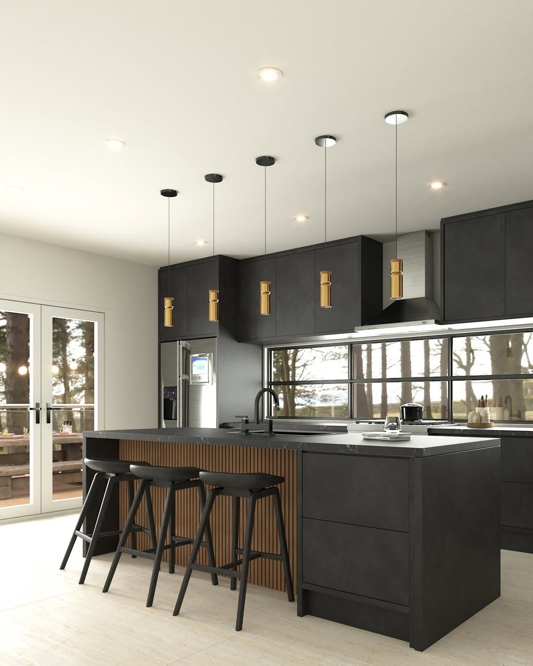 Modern kitchen with matte black cabinets, a sleek black countertop kitchen island with four black stools, pendant lights, stainless steel appliances, and large windows that reveal trees outside.