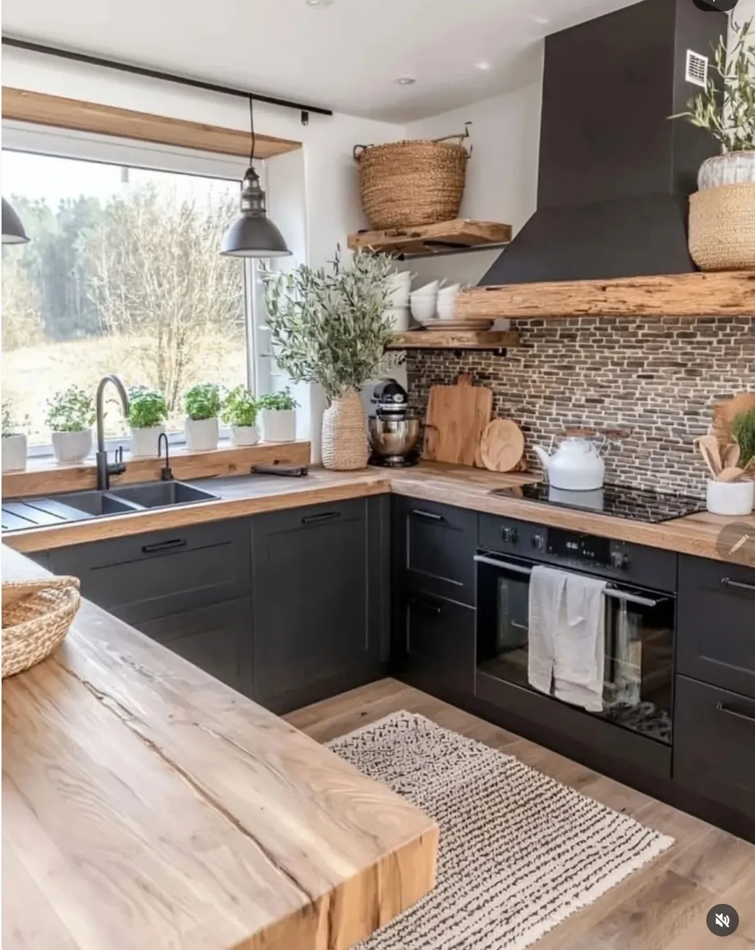 Modern kitchen with black cabinets, wooden countertops, open shelves, potted plants, a built-in oven, and a window providing natural light—an inspiring example of modern kitchen ideas and stylish kitchen design.